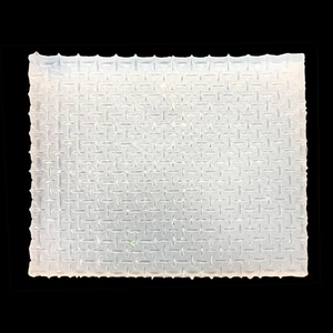 Macro detail of diamond lattice texture on white silicone fondant impression mat