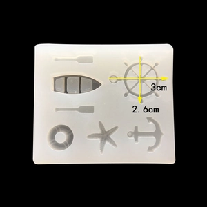 Macro view of marine theme silicone mold showing anchor and steering wheel dimensions