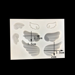 Detailed view of silicone mold with various angel wing shapes and size measurements