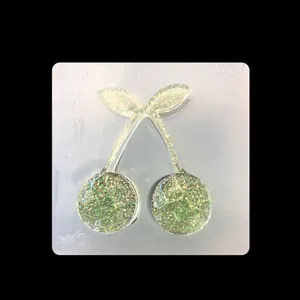 Silicone cherry mold for resin casting with glitter-filled cherry charms inside