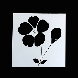 Macro detail of black floral stencil for DIY scrapbook and card making art projects
