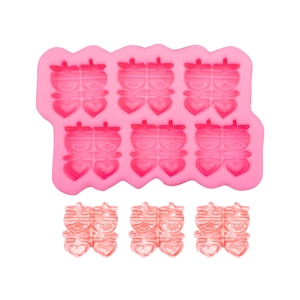 Pink silicone 6-cavity Double Happiness cake mold with heart patterns for baking