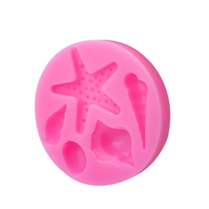 Pink ocean theme silicone mold with starfish, seashell, and conch shapes for DIY baking