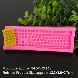 Pink silicone chocolate mold in computer keyboard shape for creative DIY baking crafts