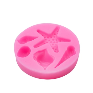 Pink silicone marine theme mold featuring starfish and seashells for baking and DIY