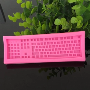 Detailed pink silicone chocolate mold in computer keyboard shape for DIY baking