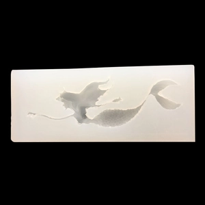 Close-up of a mermaid-shaped silicone mold with detailed scales for DIY resin jewelry