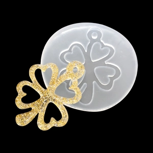 Translucent silicone resin mold for DIY four-leaf clover pendants with golden glitter finish