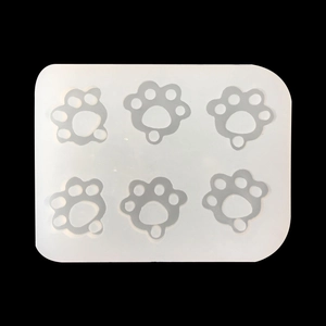Top view of translucent silicone mold featuring six cute cat paw print cavities for DIY crafts