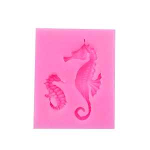 Pink silicone mold featuring two seahorses in different sizes for fondant and clay crafts