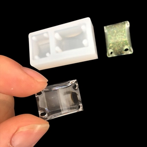 DIY silicone mold for resin jewelry pendants with transparent and gold glitter samples