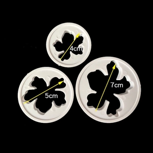Set of 3 white floral fondant cutters in 4cm, 5cm, and 7cm sizes for cake decorating