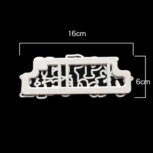 White plastic Happy Birthday cookie cutter mold with intricate hollow design for baking