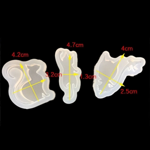 Detailed view of three cat-shaped silicone resin molds with specific size measurements