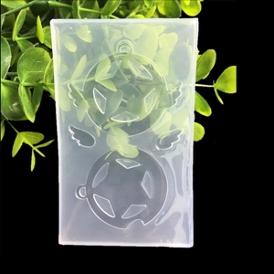 Macro view of transparent silicone mold with wing and star shapes for resin art