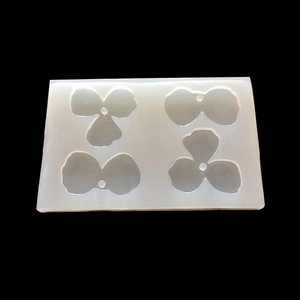 Macro shot of 4-cavity translucent silicone petal molds for DIY resin jewelry making