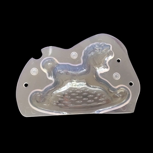 Detailed macro view of a 3D rocking horse mold for chocolate and fondant cake decoration