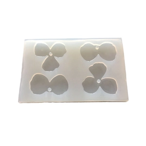 Translucent silicone resin mold with four floral petal shapes for DIY jewelry making