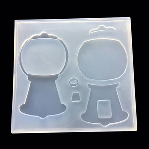 Macro shot of transparent silicone mold featuring two gumball machine shapes for DIY crafts