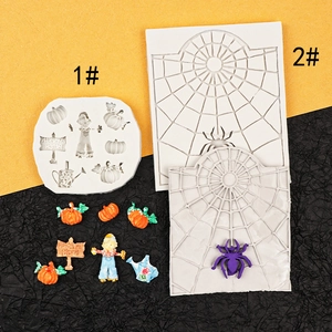 Macro detail of Halloween pumpkin and scarecrow silicone fondant molds for cake decorating