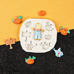 Halloween silicone mold featuring pumpkin and scarecrow shapes for festive cake decorating