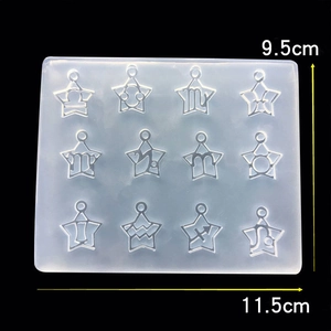 Macro view of rectangular silicone mold with 12 star-shaped zodiac sign cavities