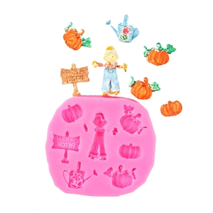 Macro shot of Halloween pumpkin patch and scarecrow silicone mold for fondant baking