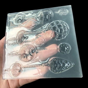 Macro shot of transparent silicone mold for DIY magic wand pendants and resin jewelry charms