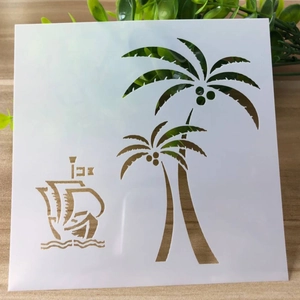 DIY painting stencil with cutout tropical coconut palm trees and sailboat on white plastic
