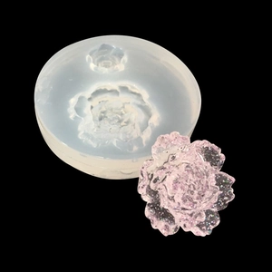Detailed translucent silicone mold showing an intricate layered flower resin casting