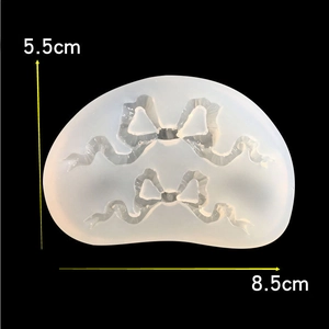 Detail view of bow ribbon silicone mold with 8.5cm by 5.5cm size dimensions shown