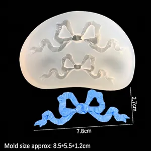 Silicone bow knot mold for resin art and clay with finished blue bow craft example