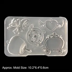Translucent silicone mold for DIY crafts featuring moon, heart and pumpkin carriage shapes