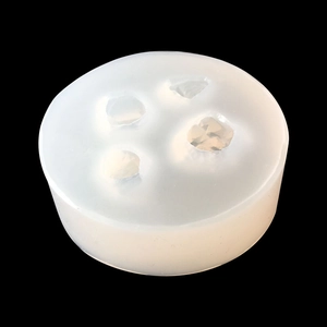 Detail view of silicone mold with four geometric crystal cluster cavities for resin art