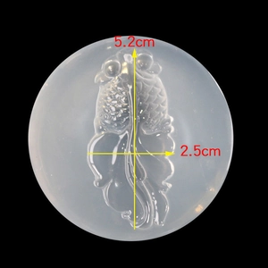 Macro view of translucent silicone mold showing detailed koi fish pattern with dimensions