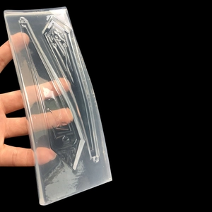 Transparent silicone mold for DIY resin craft featuring token and strip designs