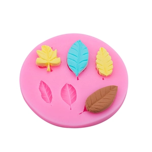 Pink silicone leaf mold for fondant and chocolate cake decorating with various leaf shapes