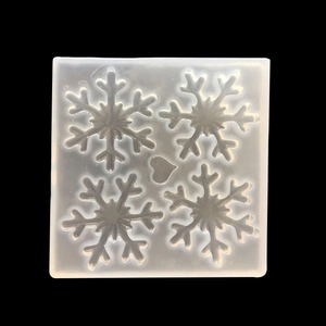 Square silicone mold featuring snowflake and heart shapes for DIY resin jewelry making