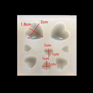 Macro shot of heart-shaped silicone molds with precise dimensions for resin DIY crafts