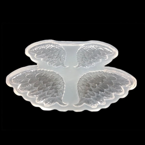 Translucent silicone mold featuring detailed angel wings and feather textures for DIY resin art