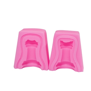 Detailed view of pink silicone molds for 3D chess rook shape fondant cake toppers