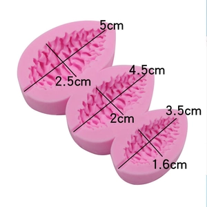 Detailed view of pink silicone leaf mold with size measurements for fondant and clay crafting