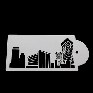 Macro shot of white flexible city skyline stencils for cake decorating on black background