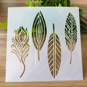 Reusable hollow PET drawing stencil featuring diverse leaf and feather designs on wood