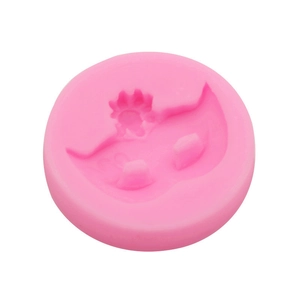 Pink round silicone mold for fondant and resin featuring detailed floral patterns
