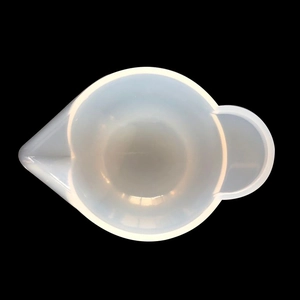 Top-down view of a 100ml translucent silicone measuring cup with a pouring spout