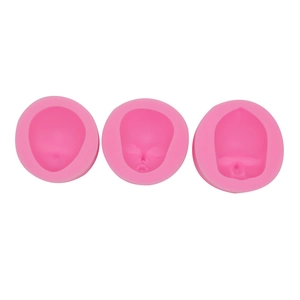 Set of three pink silicone molds featuring cute doll face designs for clay and fondant