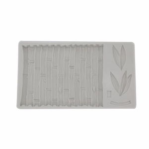 Detail showing bamboo leaf and texture patterns on a gray silicone fondant mold