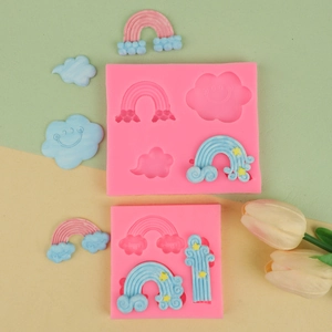 Detailed view of rainbow and cloud silicone molds for DIY fondant cake decorations