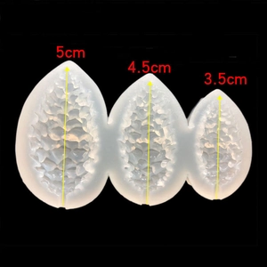 Three-size pine cone silicone molds showing scale texture and precise length measurements